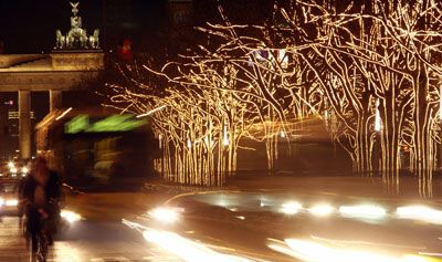 Trees at Berlin's Unter den Linden boulevard in front of the Brandenburg Gate, decorated for Christmas in November 2006.