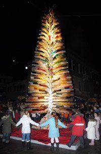 Children dance around the biggest glass tree in the world. The tree, which stood in Campto Santo Stefano square in Venice, Italy, was a creation of artist Simone Cenedese.