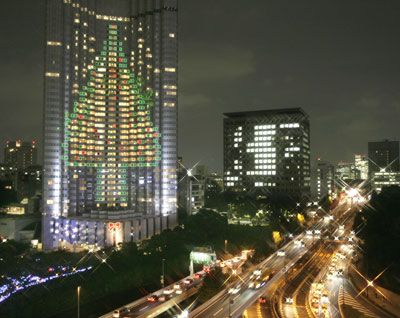 A 100-meter tall Christmas tree is illuminated on the wall of a Tokyo hotel on Nov. 6, 2007. 