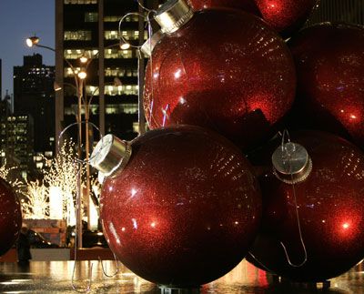 Giant Christmas tree ornaments sit in the plaza of a high-rise on 6th Avenue in New York on Dec. 6, 2006. 