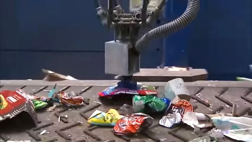 An AMP Robotics creation nicknamed Clarke was built to sort cartons in a recycling setting. Clarke's artificial intelligence programming allows it to learn more efficient ways of performing its task. WCCO - CBS Minnesota/YouTube/Screenshot: HowStuffWorks