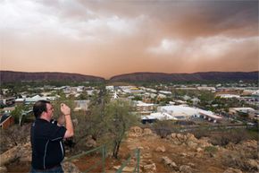 Photographing an imminent dust storm, as this Australian gentleman seems intent on doing, is just one of many ways to get your digital camera dirty.