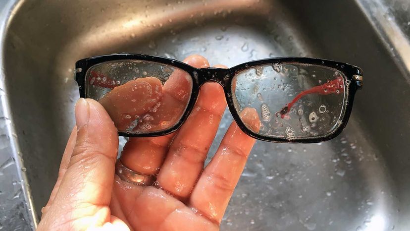 cleaning glasses with soap