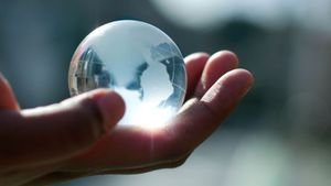 glass globe in hand