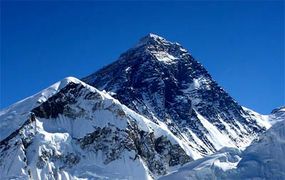 Outdoors, snow-capped mountain peak.