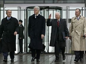 U.S. President George W. Bush (from left) and former presidents Bill Clinton,