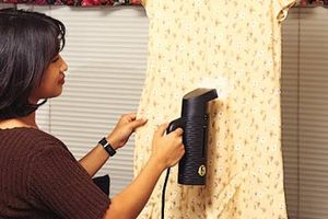 girl in with clothes steamer