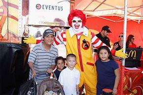 Ronald McDonald poses with fans during the Latin Grammy Street Parties 2013 in Phoenix, Ariz.