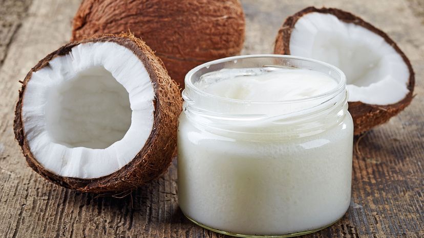 coconut oil surrounded by coconuts