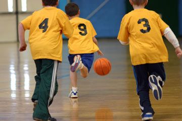 Young boys playing basketball.