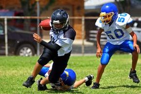 Youth boys playing football.