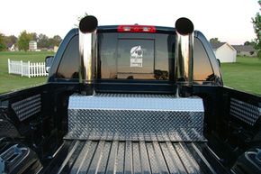 Chimney-pipe-style exhaust stacks installed in the truck bed seem to be the way to go.