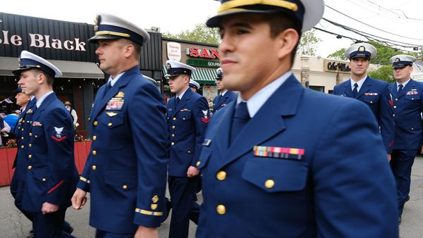 Police force in uniform marching in parade.