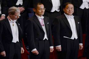 Some of the 2012 Nobel Prize winners stand during the awards ceremony in Stockholm. It costs colleges a lot to fund the professors who win these prestigious prizes and costs are often passed down to students.