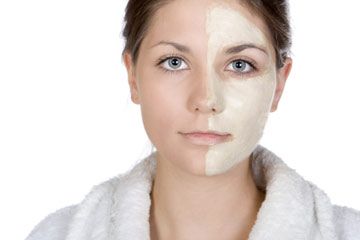 Woman with facial mask over half her face.