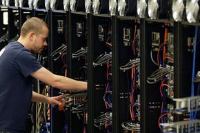 A man working on a big computer