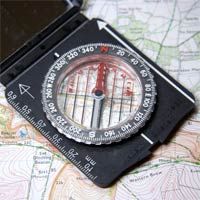 Navigate with map and compass to travel direction.