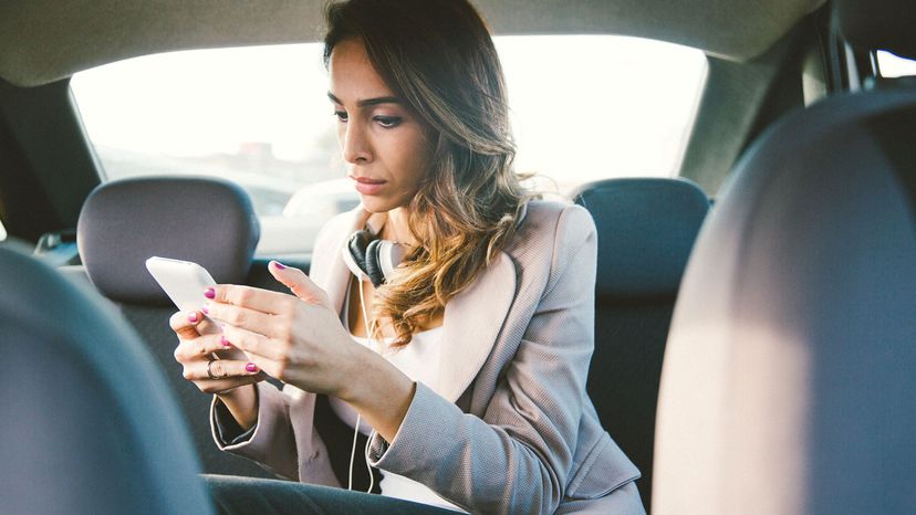 businesswoman on phone call in taxi