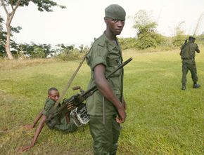 In February 2005, Congolese Green Beret soldiers patrol the Congo River in Kinshasa.