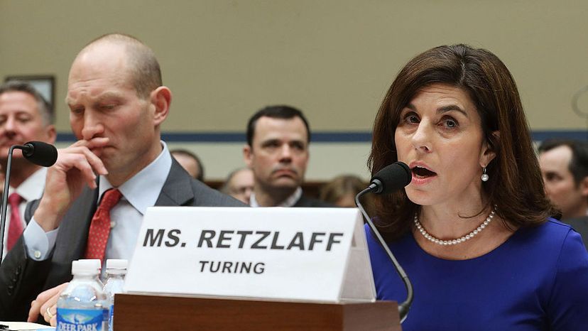 Nancy Retzlaff, chief commercial officer for Turing Pharmaceuticals, testifies while flanked by Howard Schiller (L), CEO of Valeant Pharmaceuticals, during a House Committee hearing on Capitol Hill, Feb. 4, 2016, in Washington, D.C. Mark Wilson/Getty Images