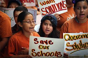 Students and parents protested funding and staff cuts outside the office of Chicago Board of Education in 2013. Earlier that year, Chicago Public Schools announced it would close more than 50 elementary schools to rein in a $1 billion budget deficit.