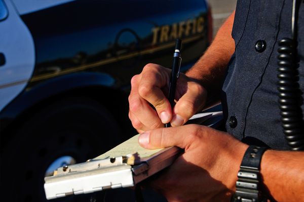 Cop writing a ticket