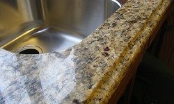 Granite counters may be a popular choice, but they aren’t low-maintenance. 
