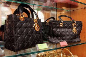 The Counterfeit Museum in Paris actually displays originals and fakes, like these Dior bags; the real one is to the left.