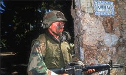 A U.S. soldier stands guard near the Noriega residence on Dec. 28, 1989, in Panama City, Panama, after American troops invaded Gen. Manuel Noriega's residence.