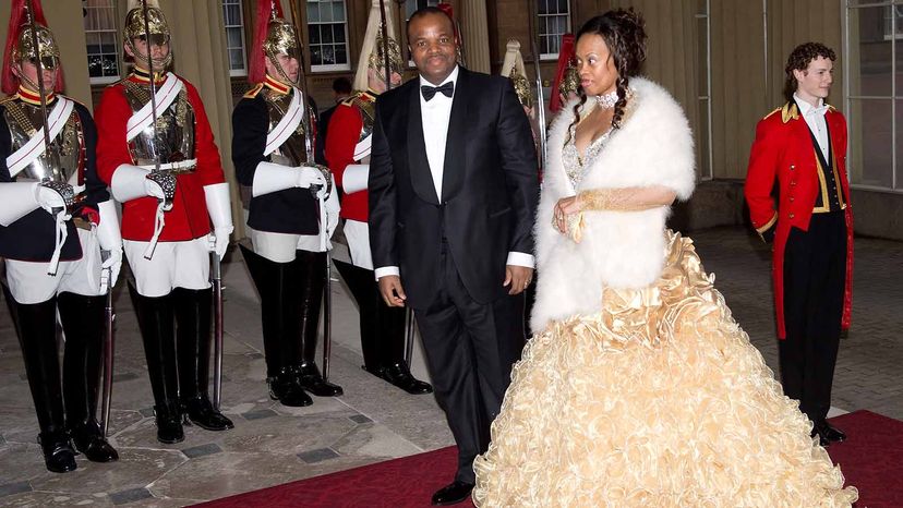 King Mswati III and Inkhosikati Lambikiza of eSwatini attend a dinner for foreign Sovereigns to commemorate the late Queen Elizabeth's Diamond Jubilee at Buckingham Palace in 2012.