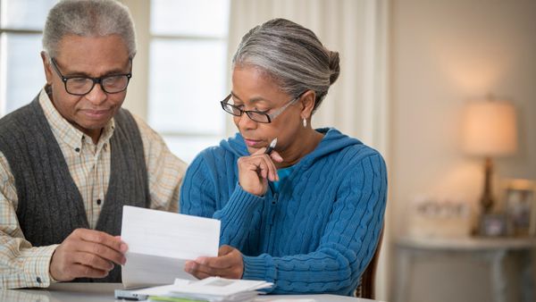 Elderly couple looking at 401K