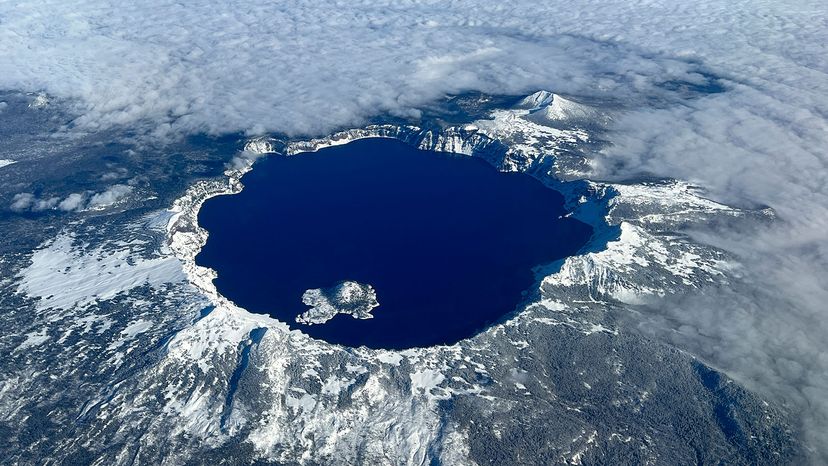 This aerial view shows Crater Lake, the caldera of an ancient volcano, in Crater Lake National Park, Oregon. Marli Miller/UCG/Universal Images Group/Getty Images
