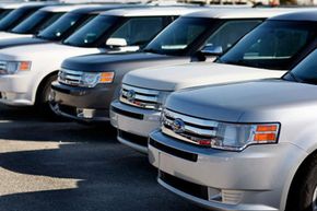 Ford Flex crossover vehicles sit on the sales lot at the Metro Ford dealership in Miami, Fla.