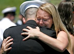 Woman cries as her brother graduates