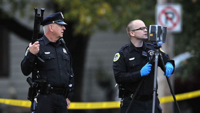 Des Moines police officers secure a crime scene 