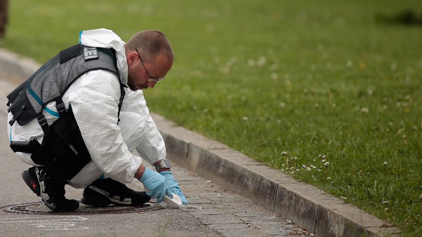 Forensic specialists of the German police secure the crime scene