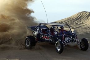 Craig Kinsman rides his dune buggy at the Imperial Sand Dunes Recreation Area near Glamis, Calif., on Nov. 22, 2002.