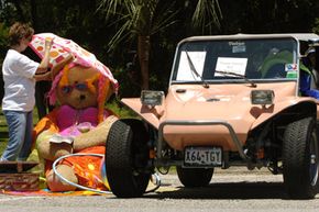 Image Gallery: Off-Roading Susan Archer makes adjustments at the display of a 1964 VW Dune Buggy during the Bay Area 15th Annual Monumental Bug Bash at San Jacinto Monument State Park in La Porte, Texas, on May 15, 2005. See more off-roading pictures.