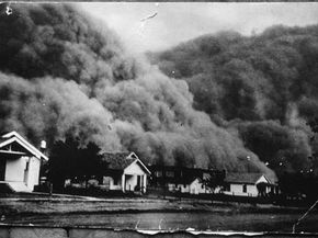 A giant dust storm blacks out the sky of Goodwell, Okla., during the Dust Bowl.