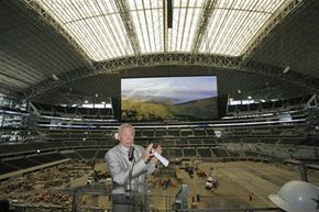 Jerry Jones in front of Dallas Cowboys scoreboard