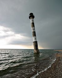 The beach where the Kiipsaar lighthouse lies has been so severely eroded by the sea that it often stands in the water.