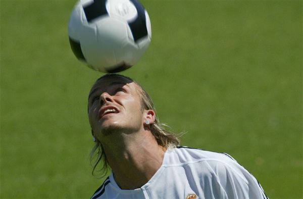 Real Madrid's superstar English player David Beckham heads the ball during a game at Sport city in Madrid, Spain, in 2003.