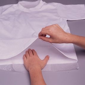 Place wax paper inside the shirt between the front and back.