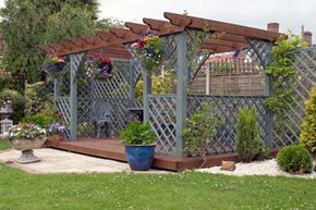 Pergolas, like this one, offer partial cover but can add more shade with climbing vines or even outdoor fabric. See more deck and patio decor pictures.