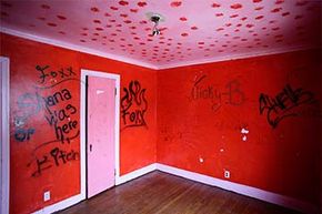 Graffiti is displayed on the bedroom wall at one of 12 homes being auctioned off (with starting bids of $1,000) in the East English Village neighborhood in Detroit, Michigan. The homes were in foreclosure.