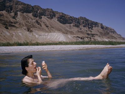 woman floating in Dead Sea