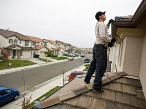 NorthWoods inspector Manny Nevarez inspects the roof of a home in Sacramento, Calif., before it goes on the market.