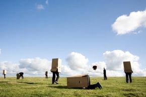 people with boxes on their heads