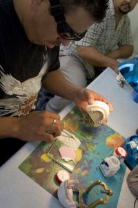 Mexican dental technicians making crowns in a lab