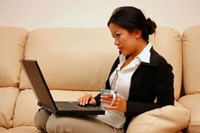 Woman on couch with laptop